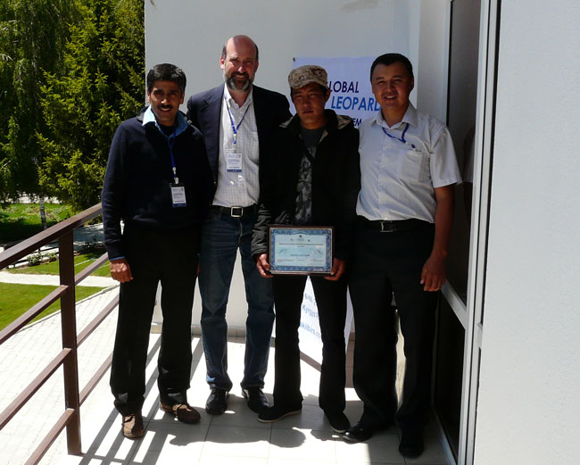 Charu Mishra, Brad Rutherford and Kuban Jumabai congratulate the Award winner