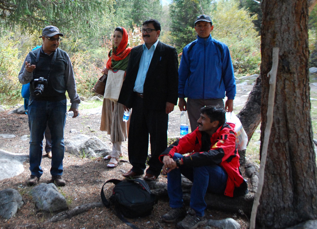 Members of the Snow Leopard Trust's Pakistan team discussing with Science & Conservation Director Charu Mishra